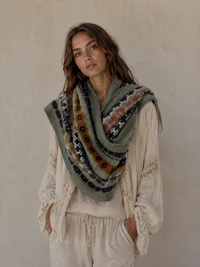Nordic Grey Snood in sage green fair isle knit, draped over the shoulders as a wide cowl