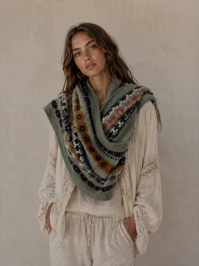 Nordic Grey Snood in sage green fair isle knit, draped over the shoulders as a wide cowl