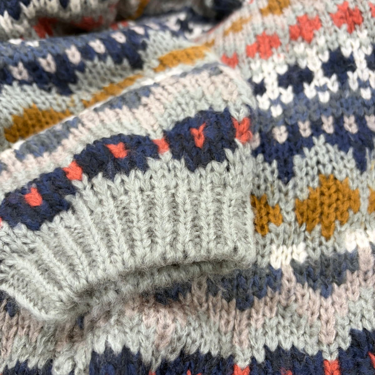Close-up of Nordic Grey Cardigan showing multi-colour fair isle knit texture in navy, mustard, rust, coral and blush - Cienna Designs