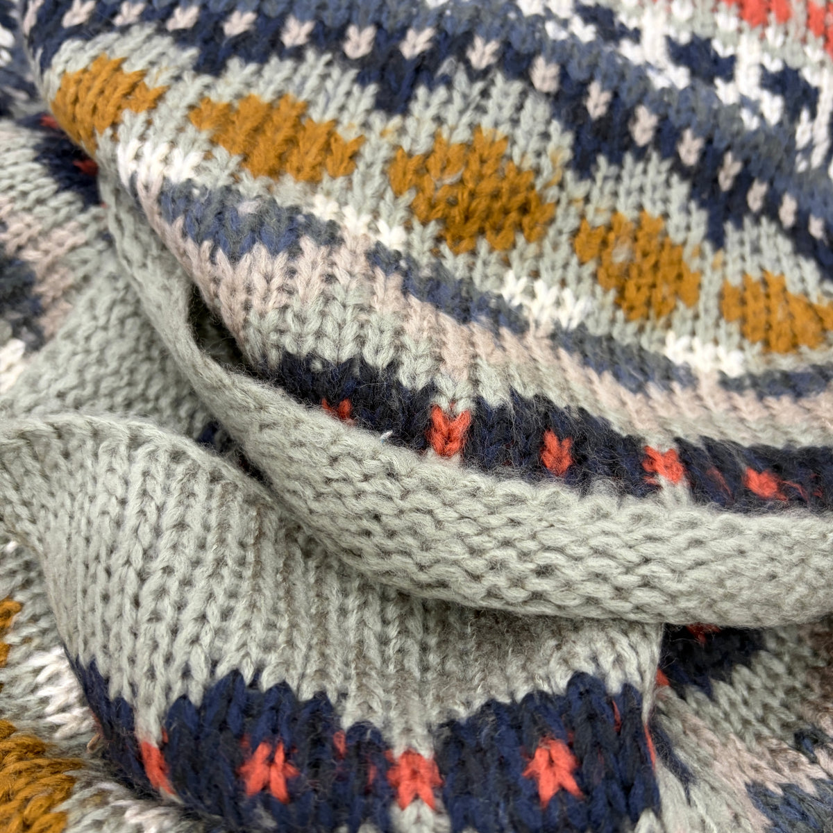 Close-up detail of Nordic Grey Snood fair isle knit in sage, navy, mustard, coral and blush