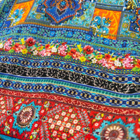 Tile Jumpsuit, close view of the mosaic border print
