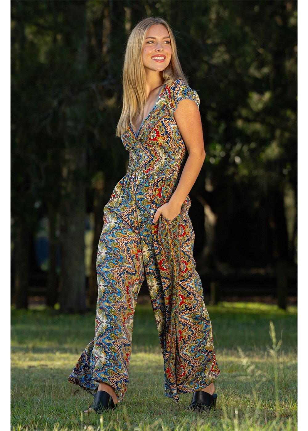 Aurora Rosa Jumpsuit jewel-toned medallion print, styled for day or evening in navy and gold — Cienna Designs
