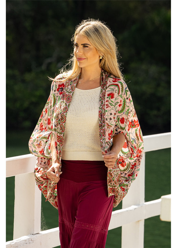 Ada Cape in pink floral silk viscose, front view worn open with split sleeves
