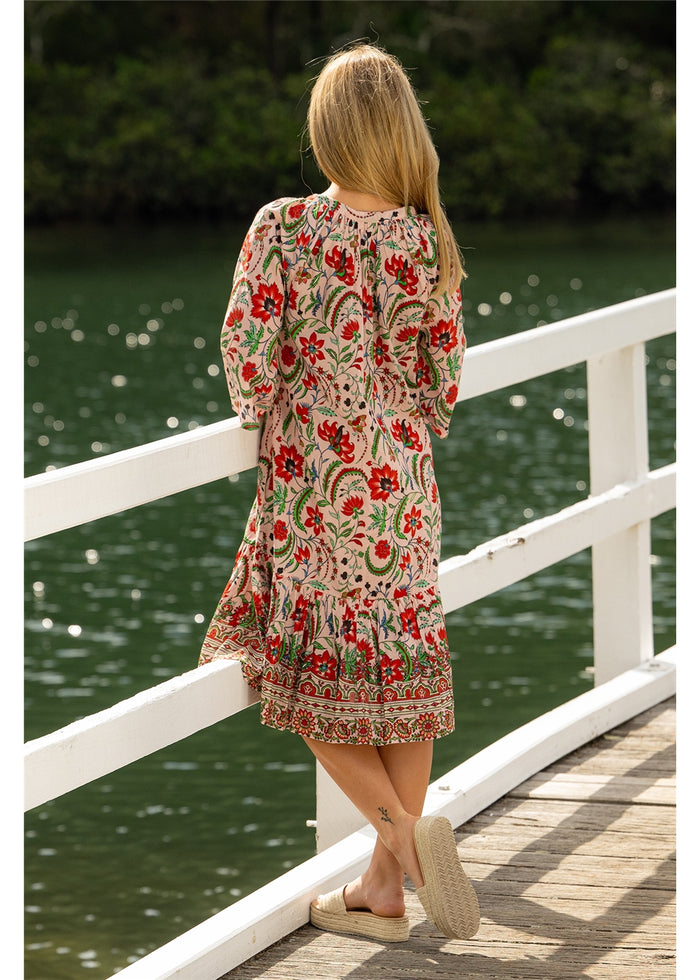 Ada Carmen Dress in pink floral cotton, back view showing the relaxed shape and gathered frill hem