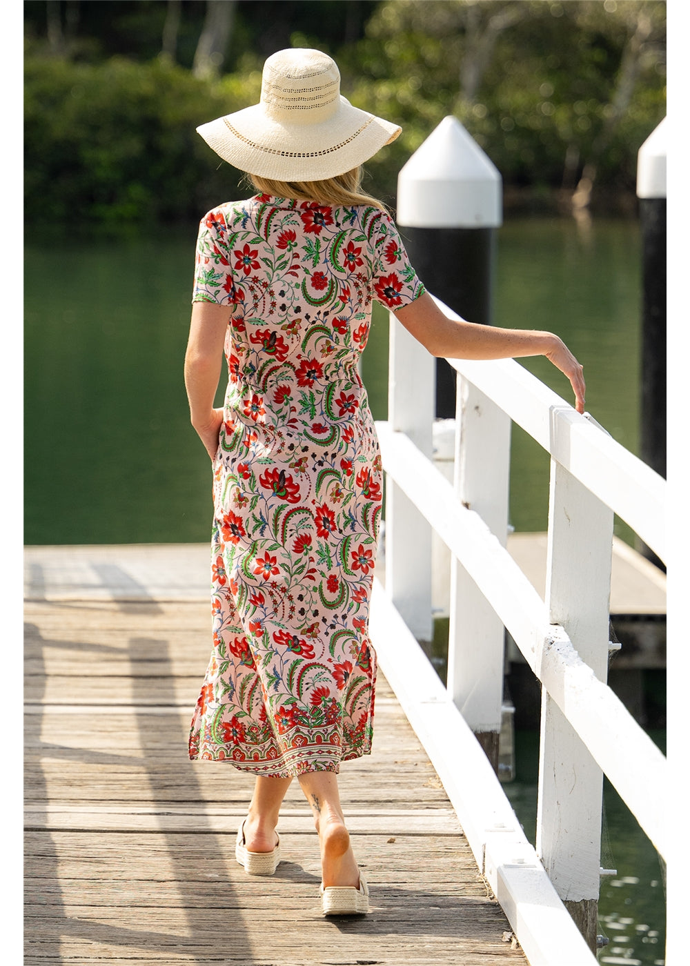 Ada Dress in pink floral cotton, back view showing the short sleeves and ankle-length skirt