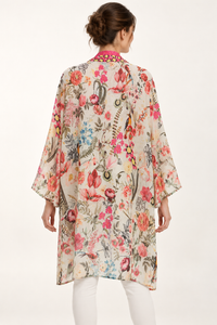 Birdsong Kimono in an ivory bird and floral print, back view showing the wide sleeves and longer back hem