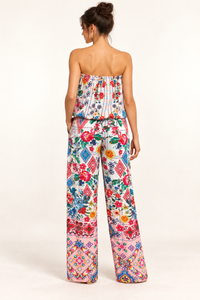 Cita Jumpsuit in ivory floral and geometric print viscose rayon, back studio view with a blouson bodice and pink borders