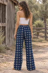 CJ-08 Floral Embroidered Jeans in indigo cotton denim with cream floral embroidery, back view on model