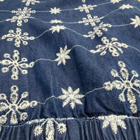 CJ-08 Floral Embroidered Jeans in indigo cotton denim, close-up of cream embroidery and waistband stitching