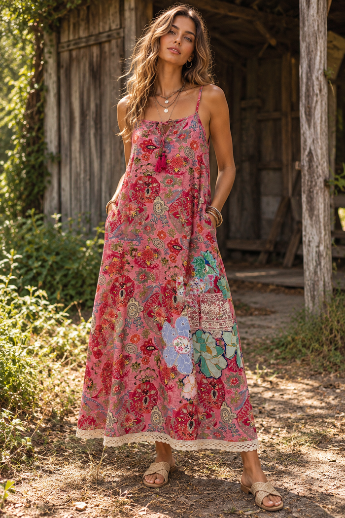 CJ-165 Floral Long Dress in pink with mixed floral prints, slender straps and a cream lace hem, front view on a model
