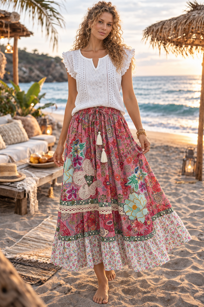 CJ-167 Floral Skirt - Pink in rose-pink floral print, front view showing floral appliqué, lace trim and tassel tie