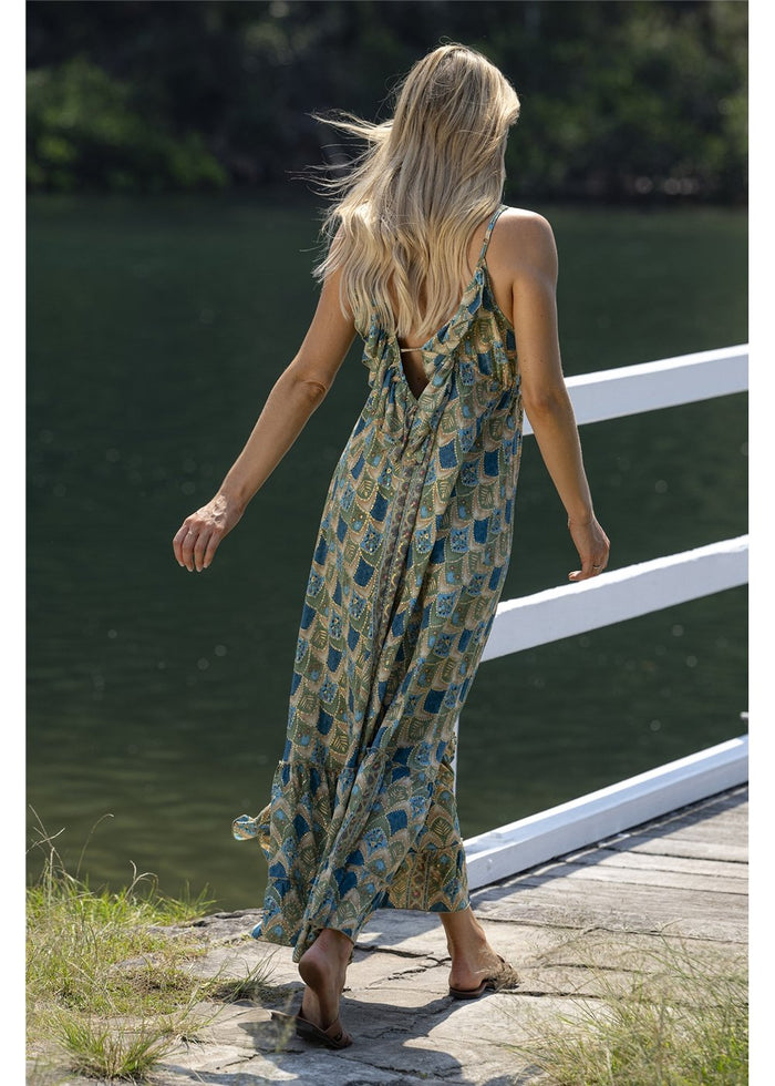Dalah Gypsy Dress in blue and green printed silk blend with gold accents, back view showing the low neckline and frill detail