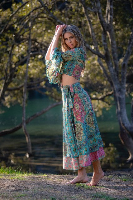 Dee Top in blue and hot pink printed silk blend, standing front view showing the knot and sleeve shape