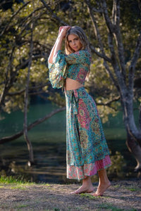 Dee Top in blue and hot pink printed silk blend, standing front view showing the knot and sleeve shape