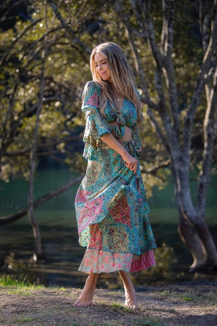 Dee Top in blue and hot pink printed silk blend, angled front view showing the sleeve drape, worn with a matching skirt