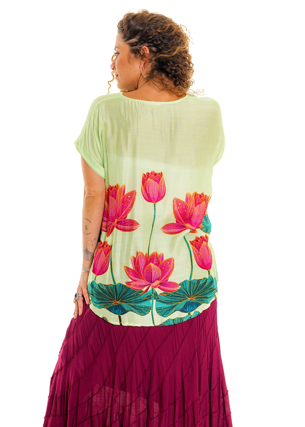 Lime Pink Lotus V-Neck Top in silk viscose, back view showing the longer hem and lotus print