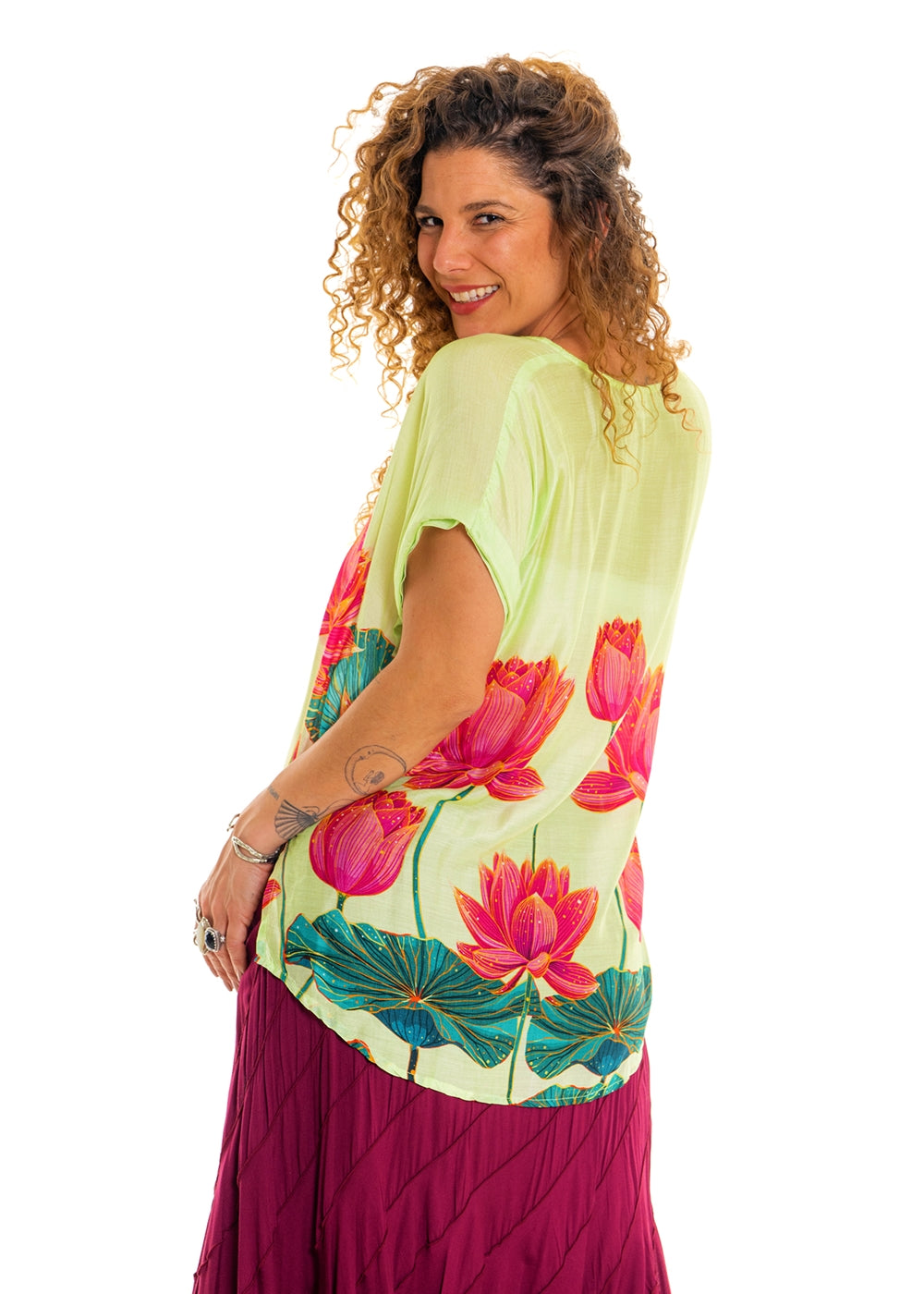 Lime Pink Lotus V-Neck Top in silk viscose, side view showing the relaxed fit and curved hem