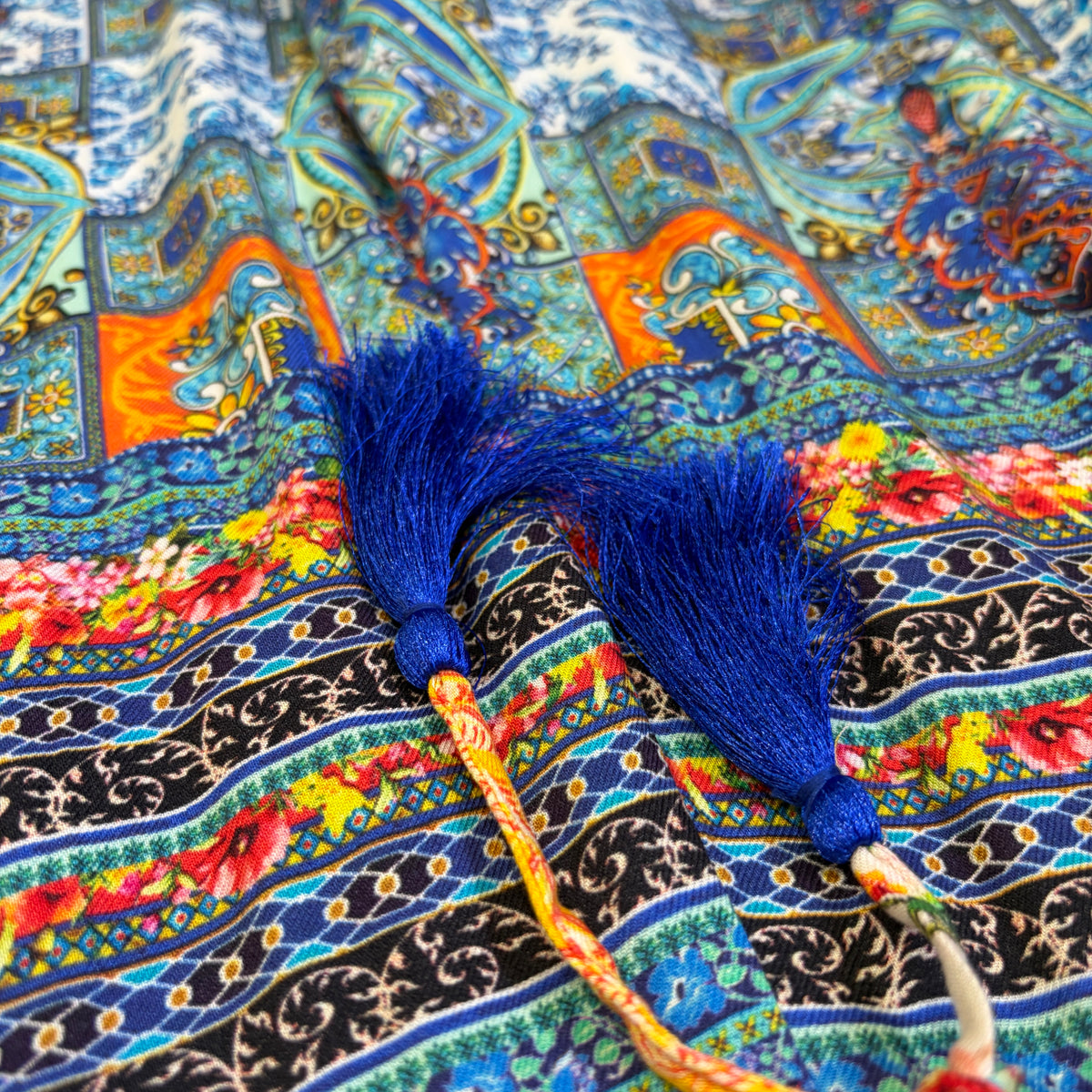 Tile Long Pants, close view of the tasselled drawstring
