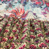 Turquoise Rhapsody Frill Dress, a blue floral and paisley viscose rayon dress, close-up of the gathered frill hem.