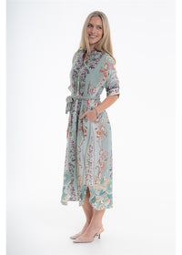 Vintage Blossom Etta Dress in blue-grey floral viscose linen, side view showing the cuffed sleeves and pockets