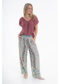 Vintage Blossom Juno Pant in blue-grey floral viscose linen, front view showing the smocked waistband and side pockets