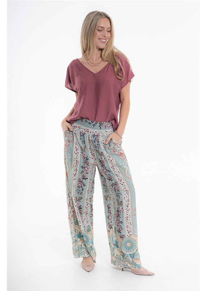 Vintage Blossom Juno Pant in blue-grey floral viscose linen, front view showing the smocked waistband and side pockets