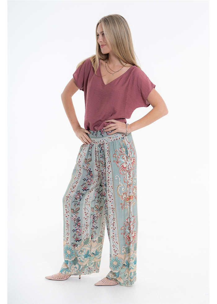 Vintage Blossom Juno Pant in blue-grey floral viscose linen, three-quarter front view showing the wide legs