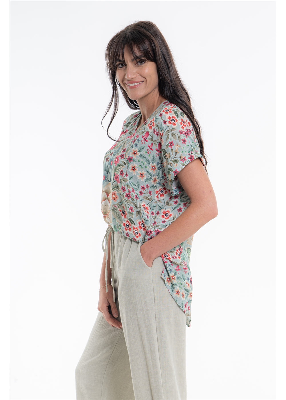 Vintage Blossom V-Neck Top in blue-grey floral viscose linen, side view showing the curved hem