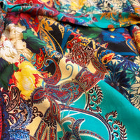 Zahara Dress in turquoise, red, blue and ivory paisley and floral print, close view of the fabric.