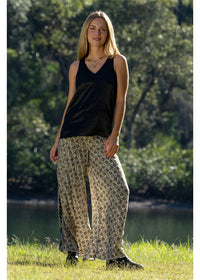 Izzy Elle Pants gold floral block print on charcoal, paired with Izzy Blouse — Cienna Designs