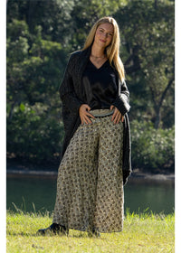 Izzy Elle Pants in flowing paisley silk-polyester, back view and detail in charcoal and gold — Cienna Designs