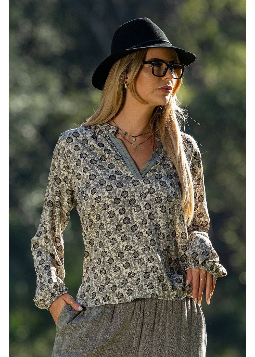 Izzy Long Sleeve Blouse gold floral on charcoal, styled for a dressed-up occasion — Cienna Designs