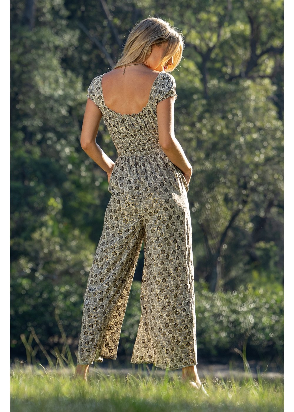 Izzy Rosa Jumpsuit in detailed gold floral block print on charcoal, flowing silk-polyester — Cienna Designs