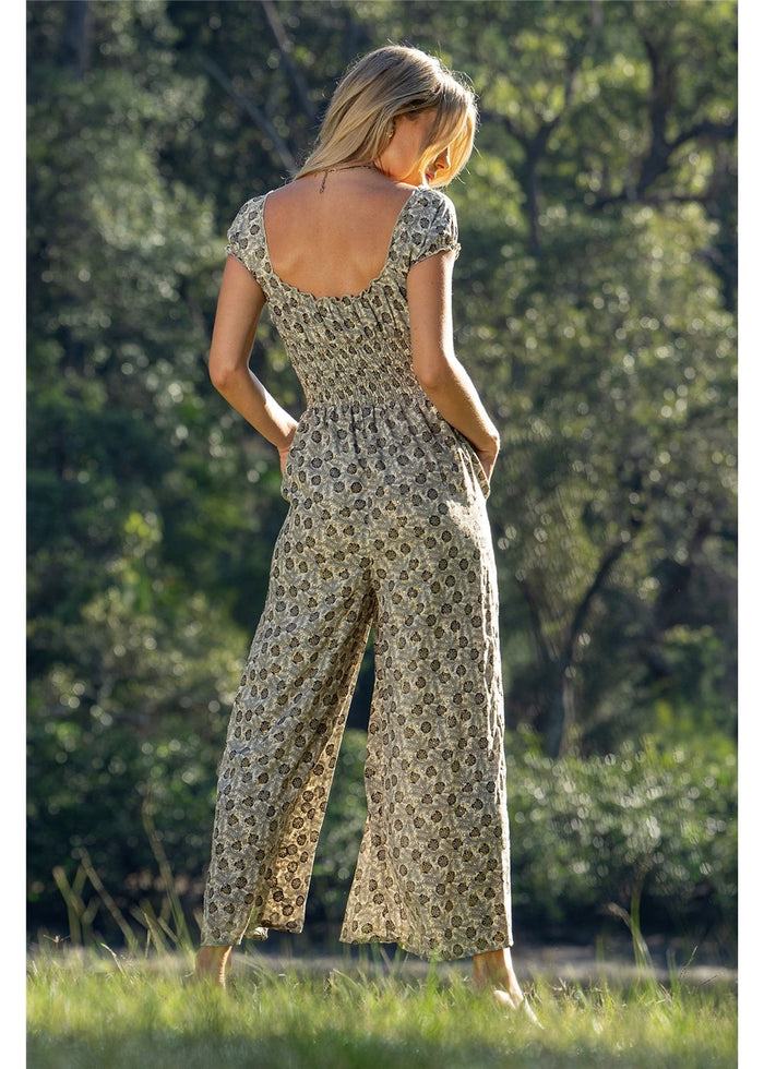 Izzy Rosa Jumpsuit in detailed gold floral block print on charcoal, flowing silk-polyester — Cienna Designs