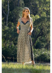 Izzy Rosa Jumpsuit gold floral on charcoal, styled for day or evening in silk-polyester blend — Cienna Designs