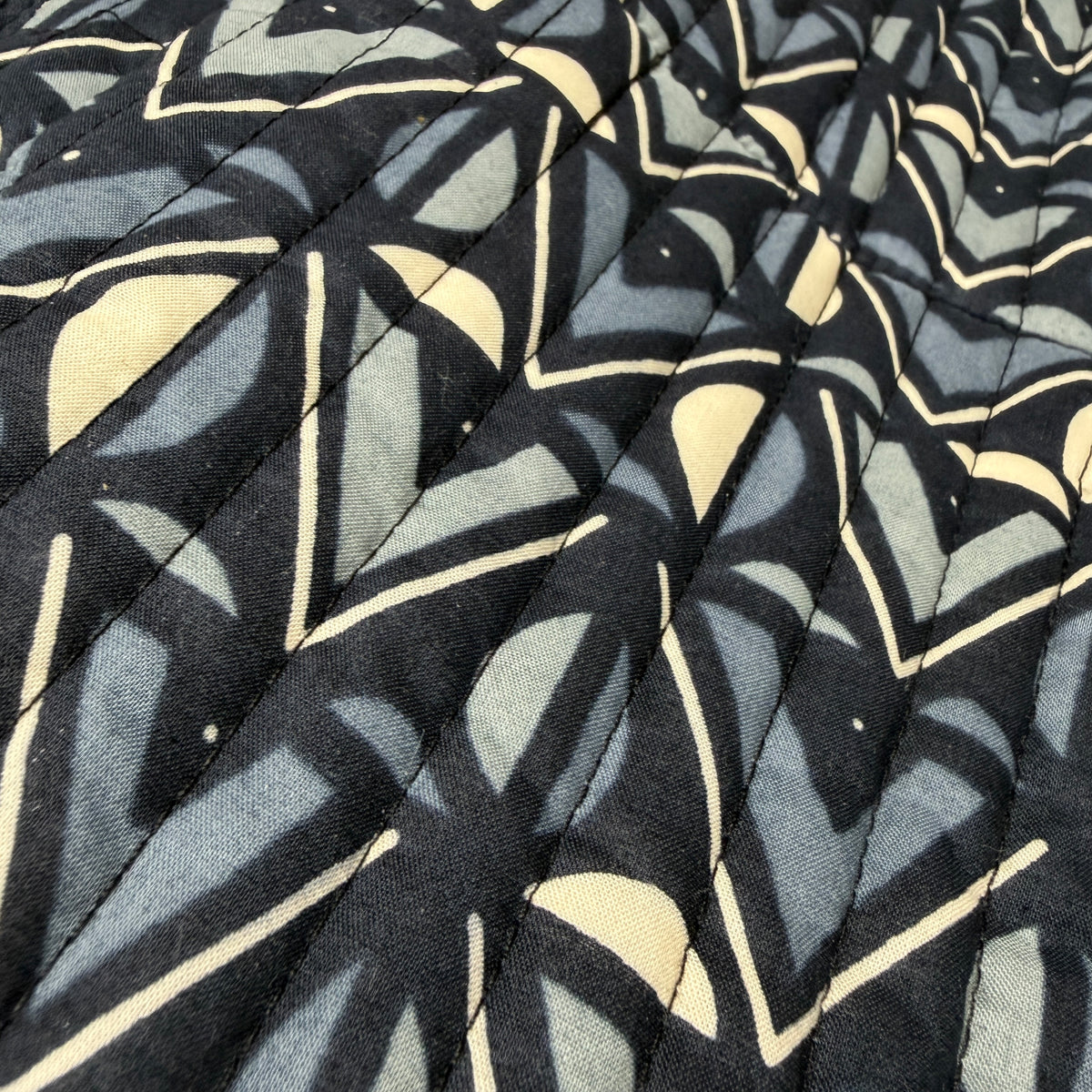 Katie geometric print quilted vest close-up detail in tonal grey and charcoal cotton - Cienna Designs