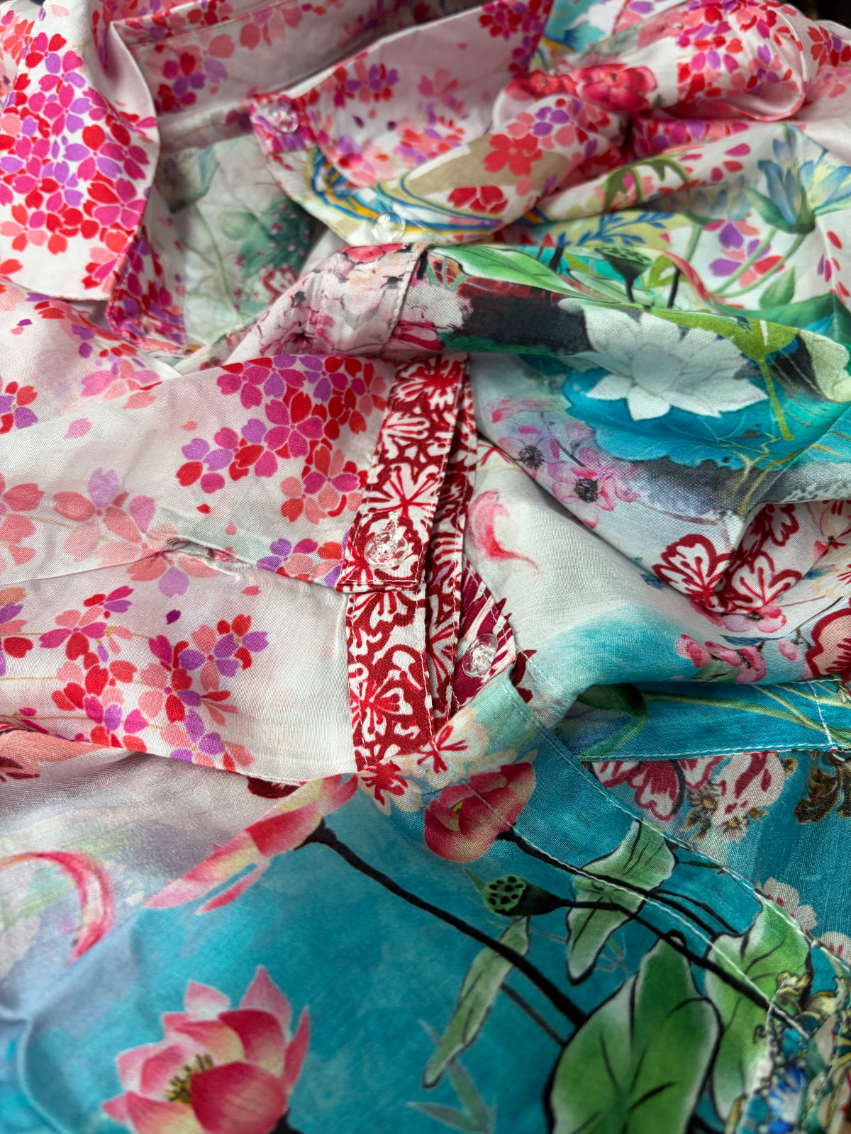 Close-up of Lotus Love shirt showing bold floral print in romantic pink tones on fluid semi-sheer silk-viscose blend - Cienna Designs
