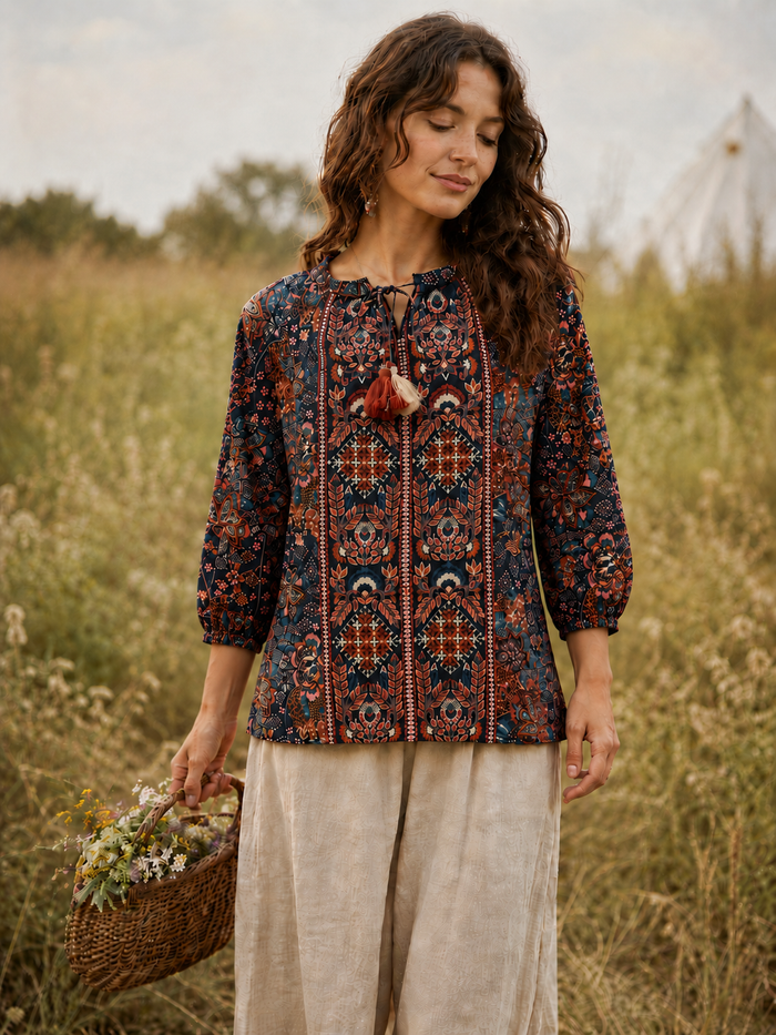 Midnight Folk embroidered blouse in deep navy rayon with folk floral print, embroidered front panel, tassel tie neckline and lace-trim elasticated cuffs - Cienna Designs