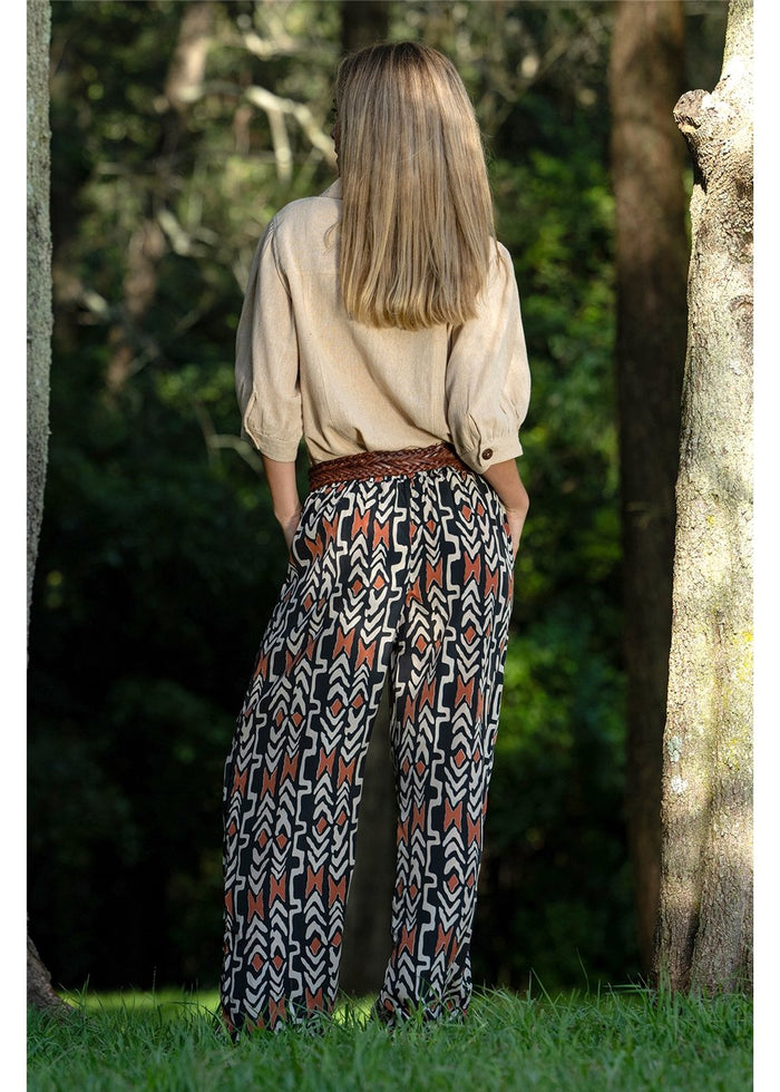 Myee Hemi Pant in black terracotta and ivory tribal print, wide-leg silhouette in silk-polyester — Cienna Designs