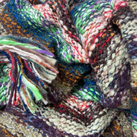 Close-up of Nia Neon Turtleneck Poncho showing vibrant blue and green knit texture - Cienna Designs