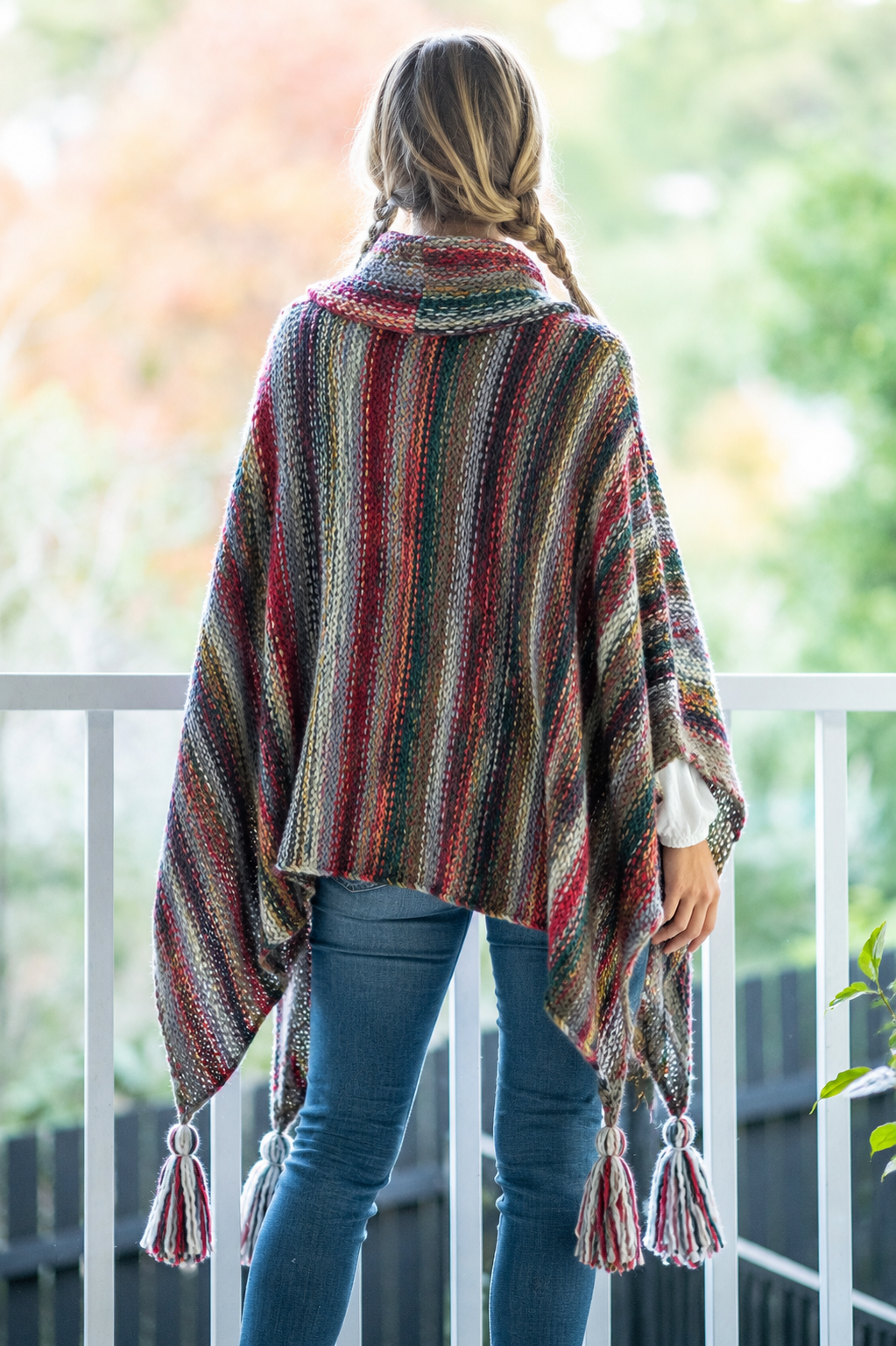 Nia Woodland Turtleneck Poncho styled view in red and green woodland knit - Cienna Designs