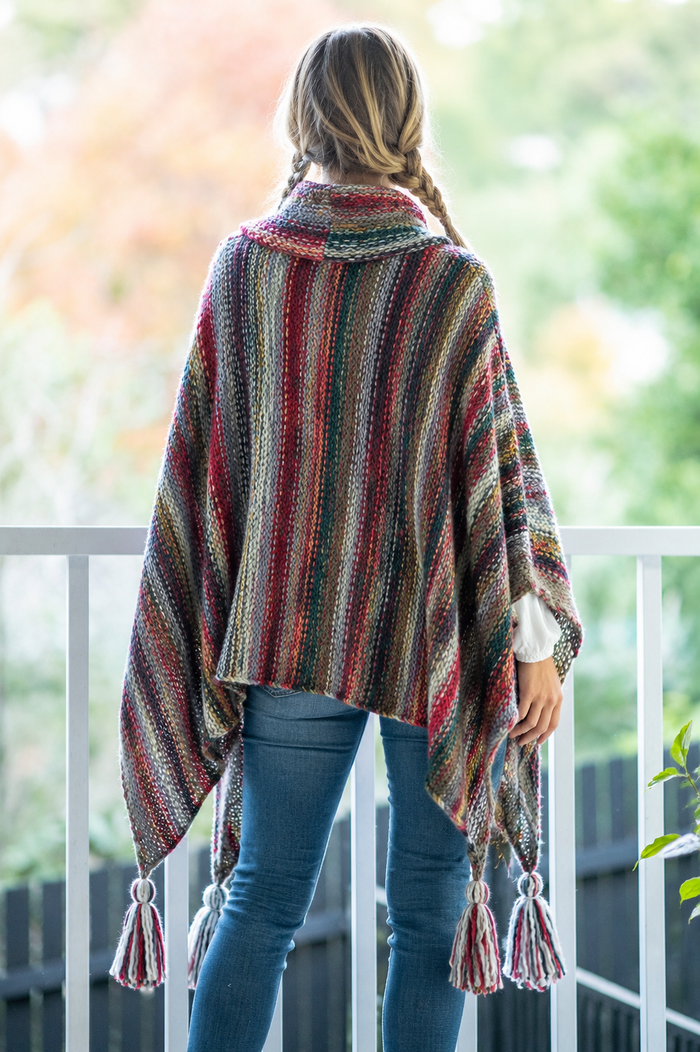 Nia Woodland Turtleneck Poncho styled view in red and green woodland knit - Cienna Designs