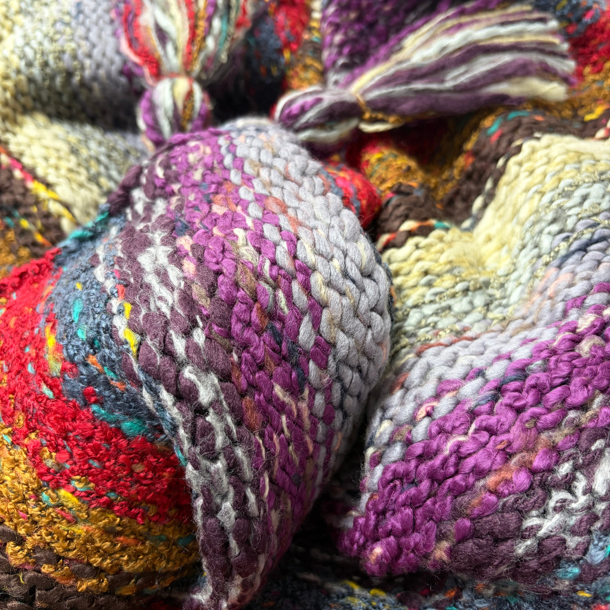 Close-up of Nia Wine Turtleneck Poncho showing deep wine and purple knit texture - Cienna Designs