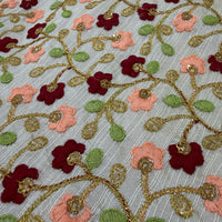 Close-up of raw silk floral embroidery with soft peach and deep burgundy blooms, green leaf embroidery and gold zari rope vines with sequin centres - Festival Jacket Green by Cienna Designs