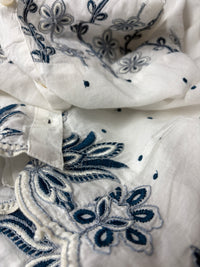 Phoebe Top close-up showing navy embroidery across the yoke and scalloped hem detail on 100% cotton - Cienna Designs