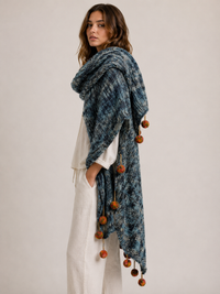 Pompom Wrap blue blush knit draped over shoulders