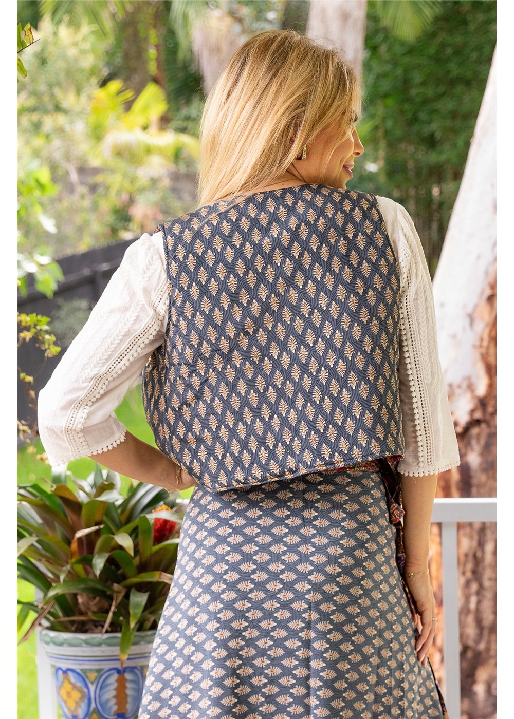 Shasha Quilted Waistcoat Reversible - slate blue botanical side, back view