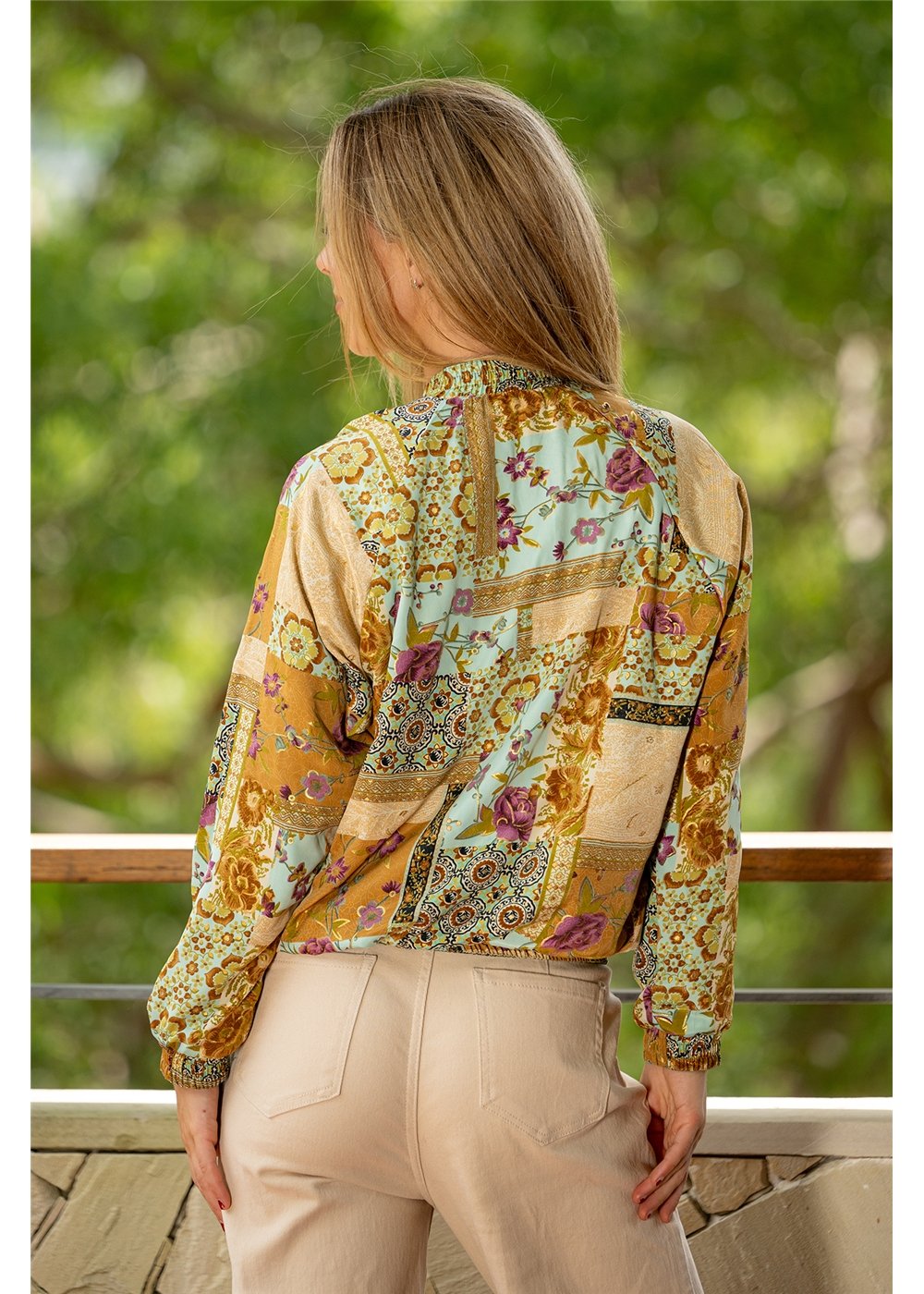 Model styling the Sherwood Reversible Bomber, a two-in-one boho jacket in paisley print silk-polyester — Cienna Designs