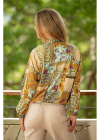Model styling the Sherwood Reversible Bomber, a two-in-one boho jacket in paisley print silk-polyester — Cienna Designs
