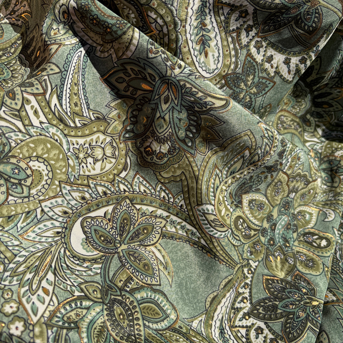 Sherwood Wrap Skirt in silk-polyester paisley, cream gold and green on model — Cienna Designs